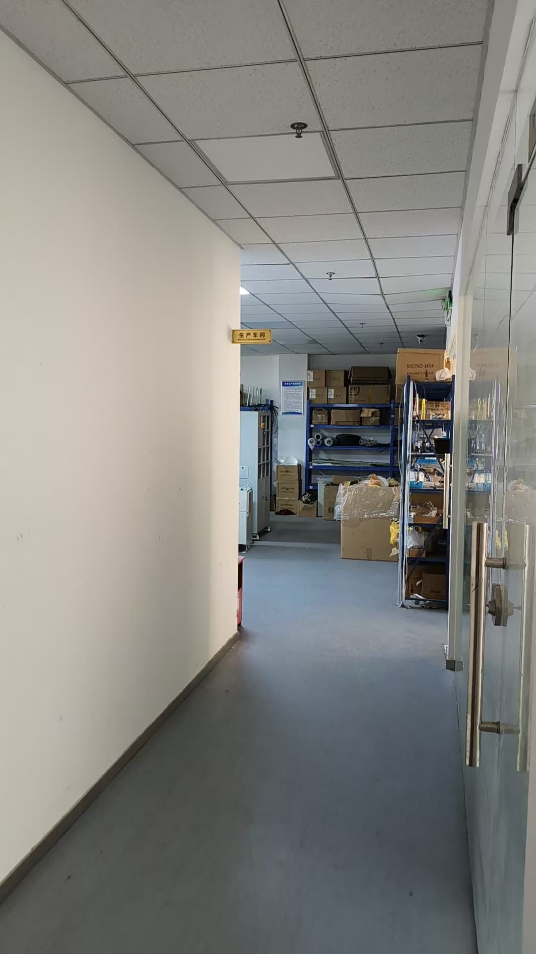 Production workshop hallway with component storage